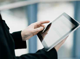 Picture of a man holding an iPad